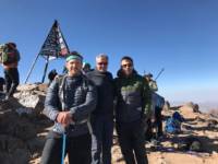 Chris Henry, NICHS Deputy CEO Gareth McGleenon and Tommy Bowe at the top of Mount Toubkal in Morroco