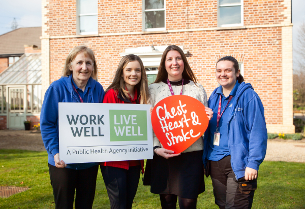 Rebecca Hawkins Workplace Health and Wellbeing Co ordinator at Northern Ireland Chest Heart Stroke and Ashley Bolton Employment Officer at Stepping Stones NI with Stepping Stones NI staff